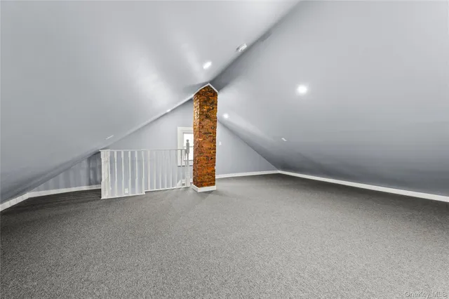 a view of an empty room with stairs