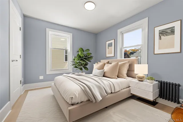 a bedroom with bed and a window