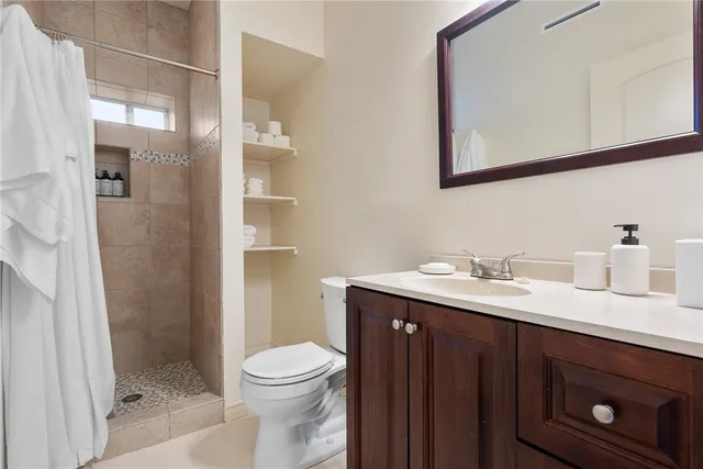 an aerial view of a swimming pool with outdoor seating