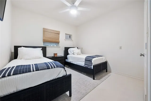 a view of a house with pool lawn chairs and a yard