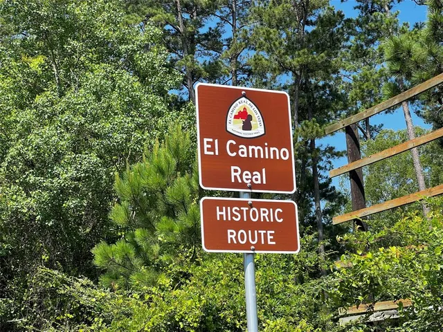 a street sign on a pole on a road