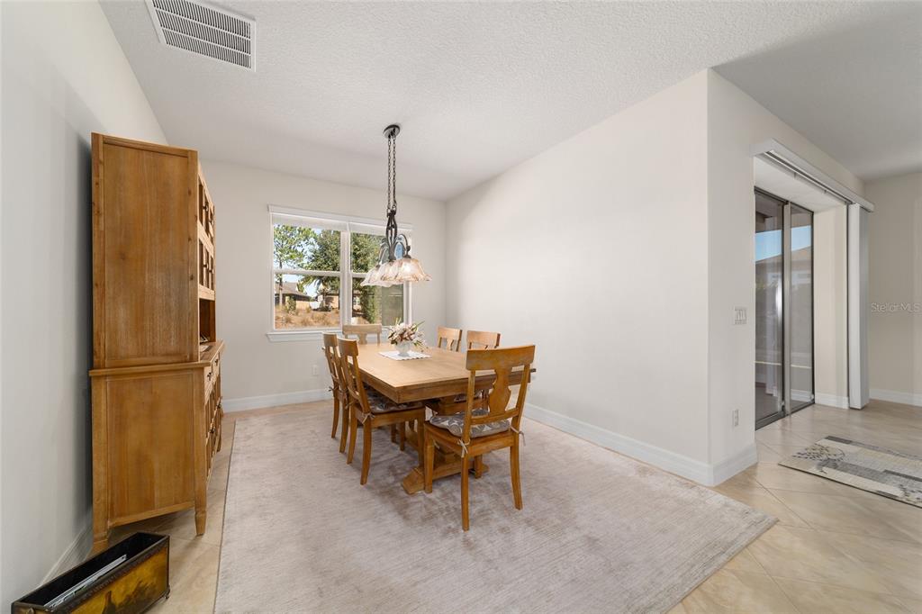 9603 Southwest 67th Street Ocala, FL 34481 - Photo 20 of 63 a view of a dining room with furniture window and outside view