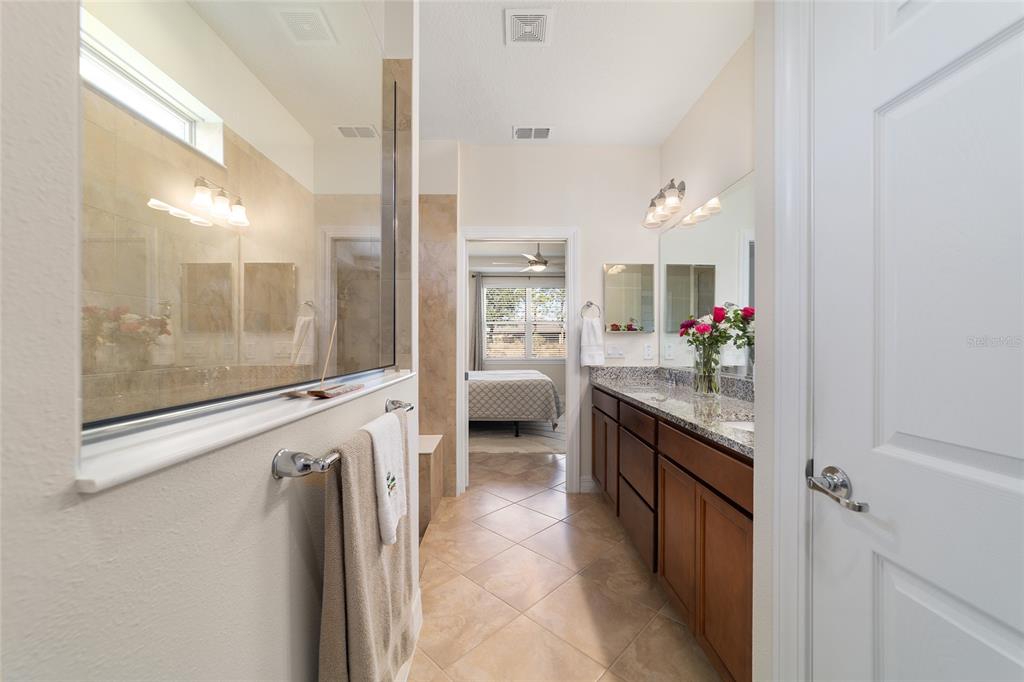 9603 Southwest 67th Street Ocala, FL 34481 - Photo 28 of 63 a kitchen with granite countertop a sink and cabinets