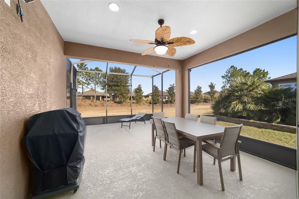 9603 Southwest 67th Street Ocala, FL 34481 - Photo 43 of 63 a dining room with furniture and a large window