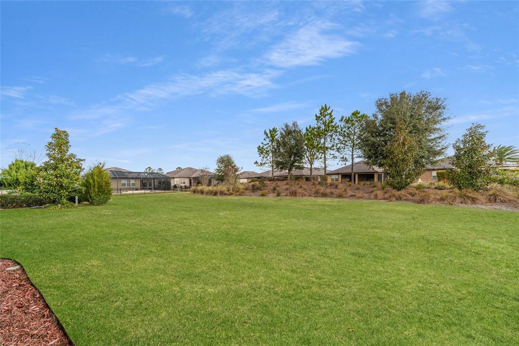 9603 Southwest 67th Street Ocala, FL 34481 - Photo 49 of 63 a view of a green field with clear sky