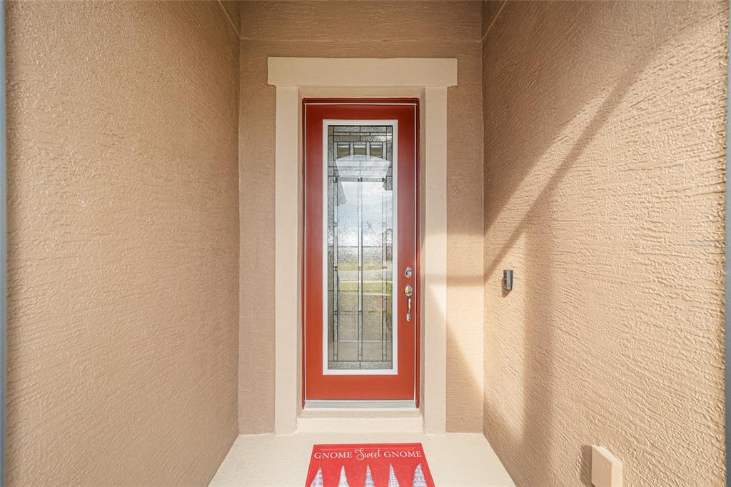 9603 Southwest 67th Street Ocala, FL 34481 - Photo 5 of 63 a view of a hallway with wooden floor and a door