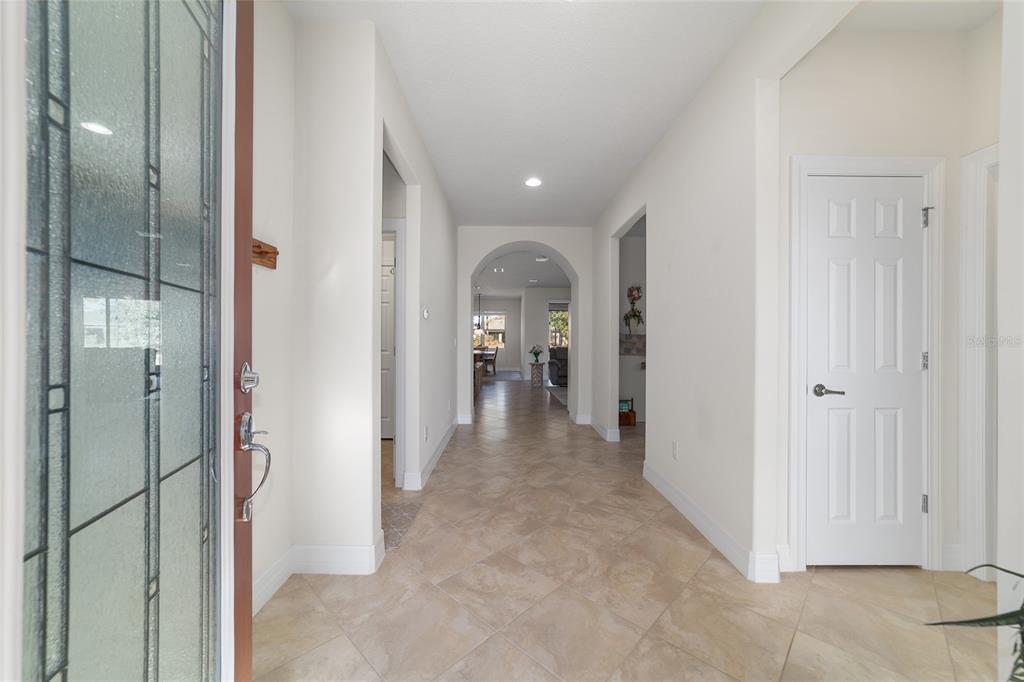 9603 Southwest 67th Street Ocala, FL 34481 - Photo 6 of 63 a view of a hallway with wooden shelves