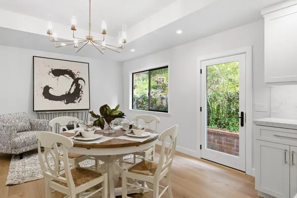 a view of a dining room with furniture window and outside view