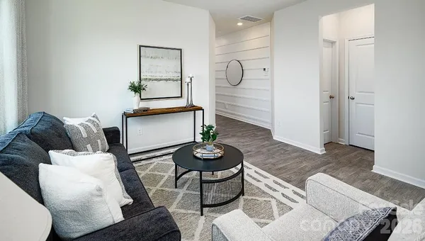 a living room with furniture and a table