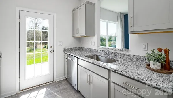 a kitchen with sink and window