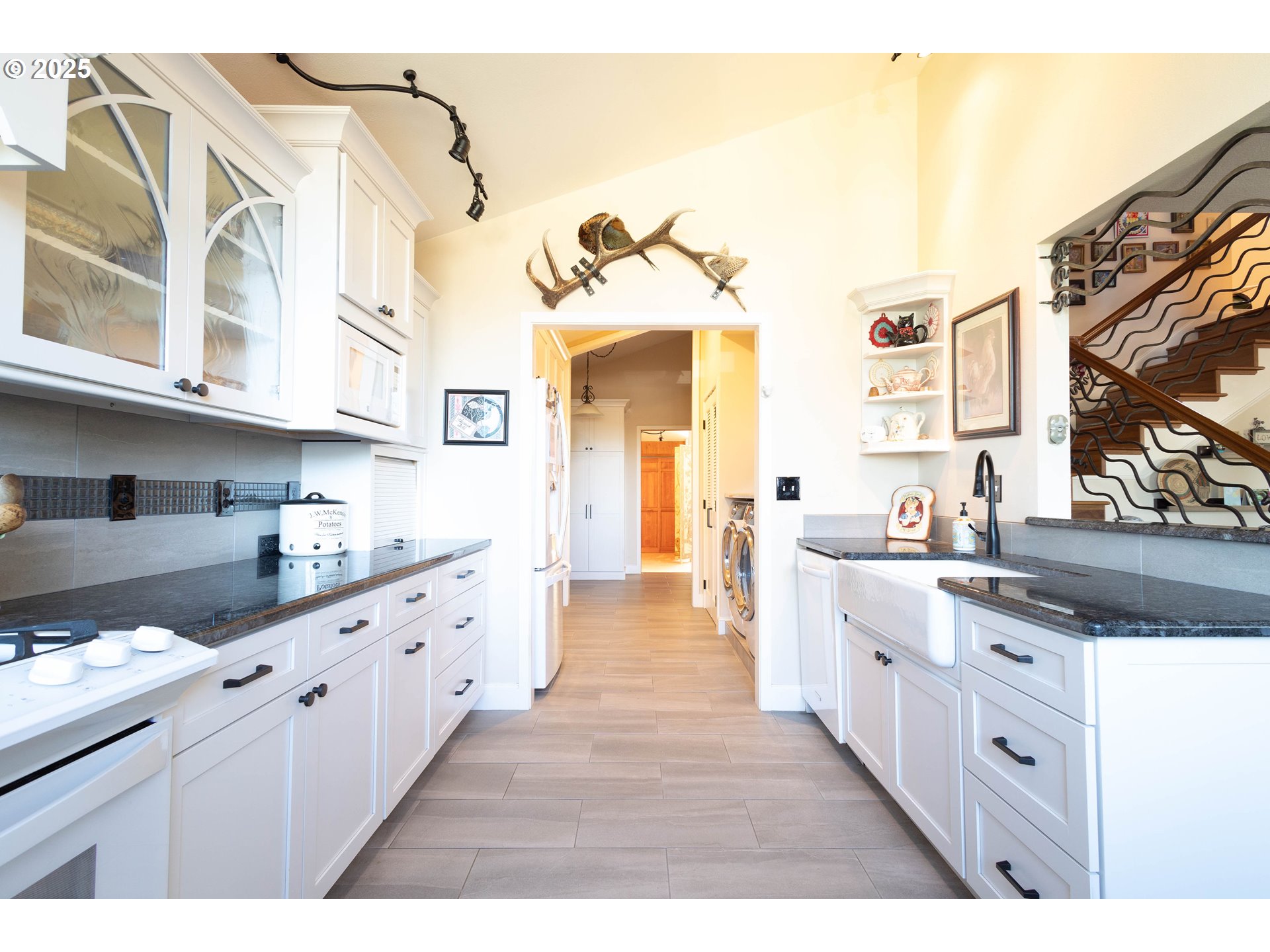 1902 Highland Drive La Grande, OR 97850 - Photo 23 of 46 a large kitchen with cabinets a sink and a stove