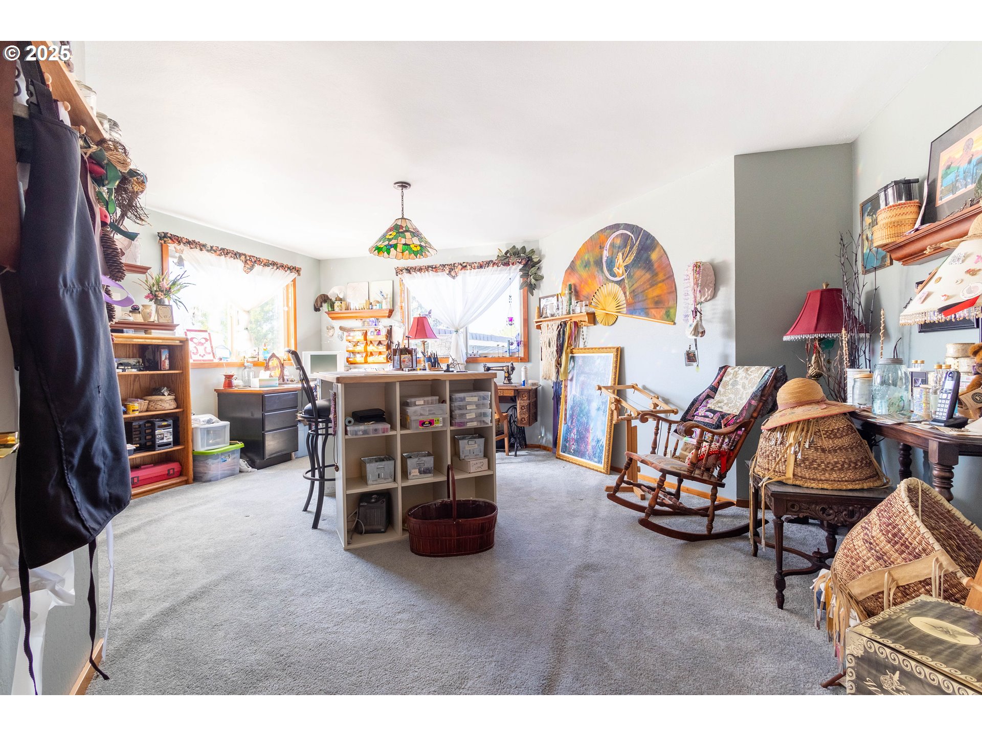 1902 Highland Drive La Grande, OR 97850 - Photo 36 of 46 a living room with furniture a window and a flat screen tv