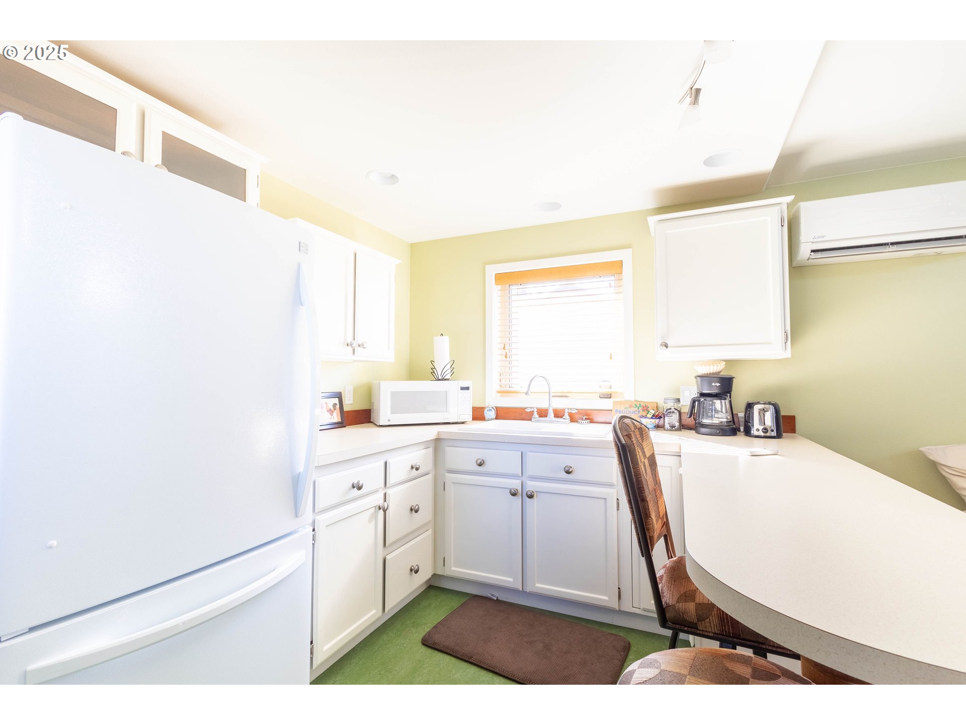 1902 Highland Drive La Grande, OR 97850 - Photo 38 of 46 a kitchen with a sink a window and cabinets