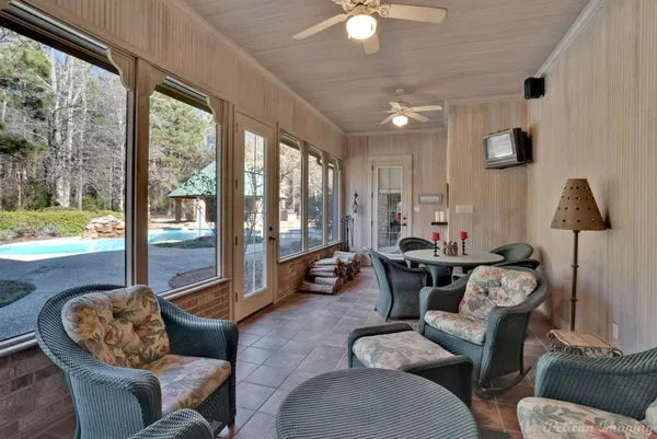 a living room with furniture and a flat screen tv