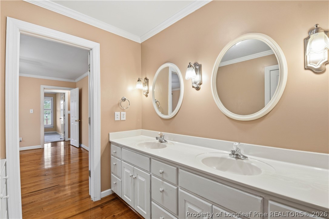 2000 Moltonville Road Clinton, NC 28328 - Photo 24 of 49 a bathroom with a double vanity sink and a mirror