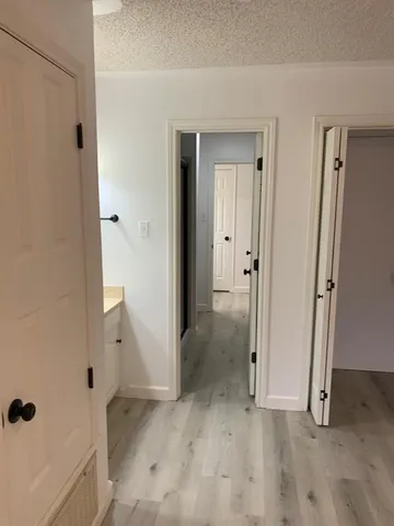 a bathroom with a double vanity sink a mirror and shower