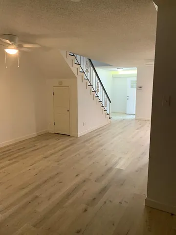 a view of an empty room with stairs