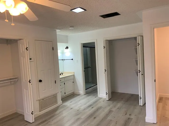 a view of a bathroom with a glass door shower