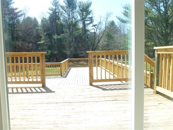 201 Walnut Plain Road Rochester, MA 02770 - Photo 10 of 29 a view of a balcony with wooden floor