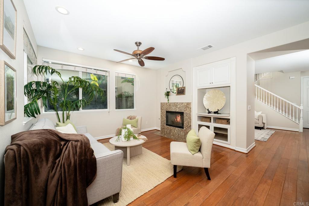 5406 Foxtail Loop Carlsbad, CA 92010 - Photo 12 of 50 a living room with furniture fireplace and a large window