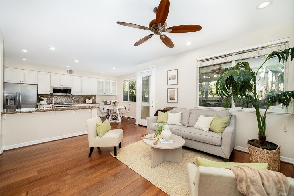 5406 Foxtail Loop Carlsbad, CA 92010 - Photo 13 of 50 a living room with furniture kitchen view and a large window