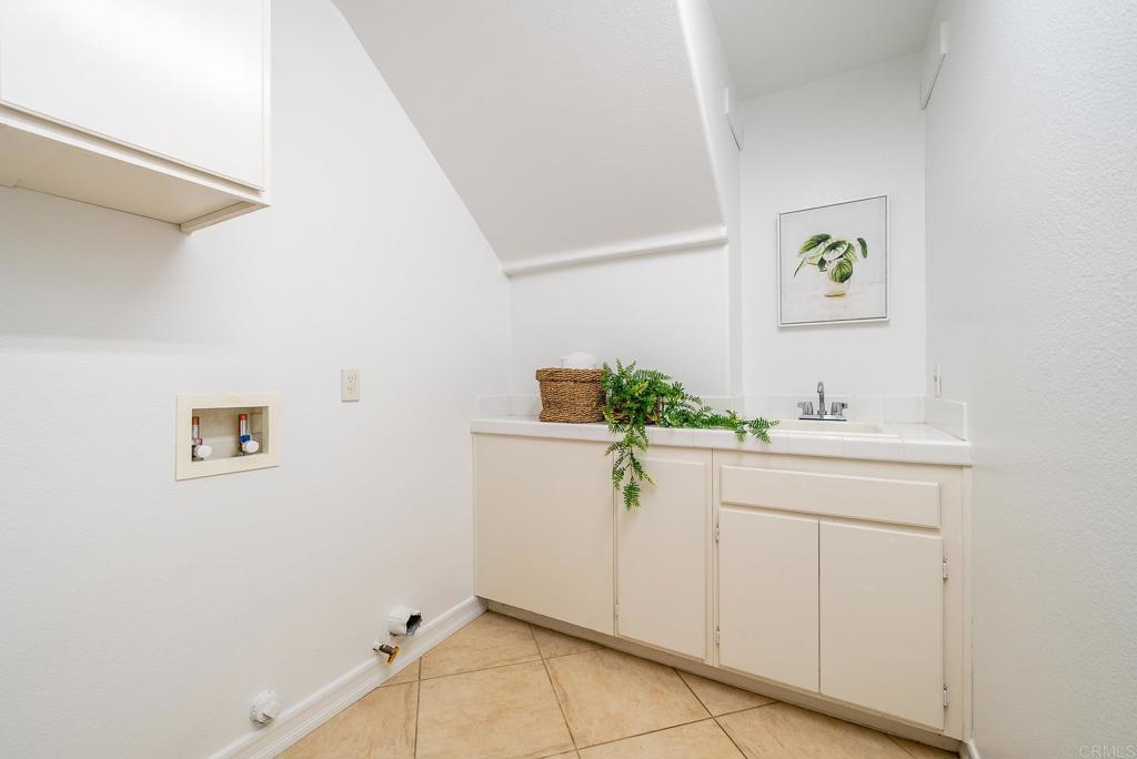 5406 Foxtail Loop Carlsbad, CA 92010 - Photo 19 of 50 a bathroom with a sink and a window