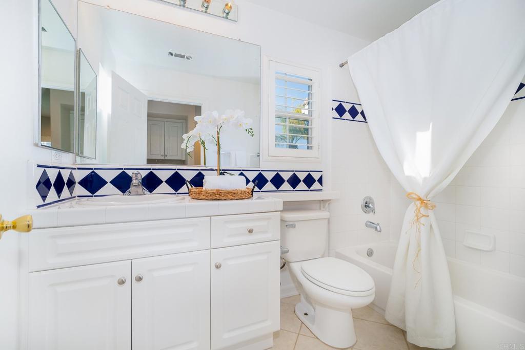5406 Foxtail Loop Carlsbad, CA 92010 - Photo 33 of 50 a bathroom with a sink and a mirror