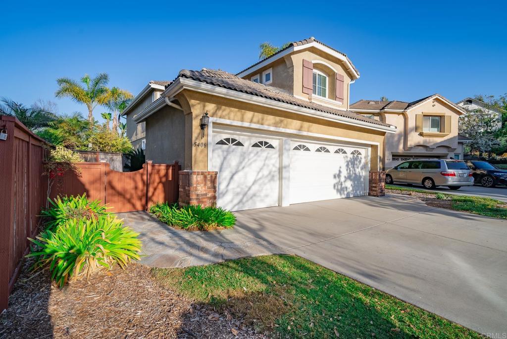 5406 Foxtail Loop Carlsbad, CA 92010 - Photo 35 of 50 a front view of a house with garden