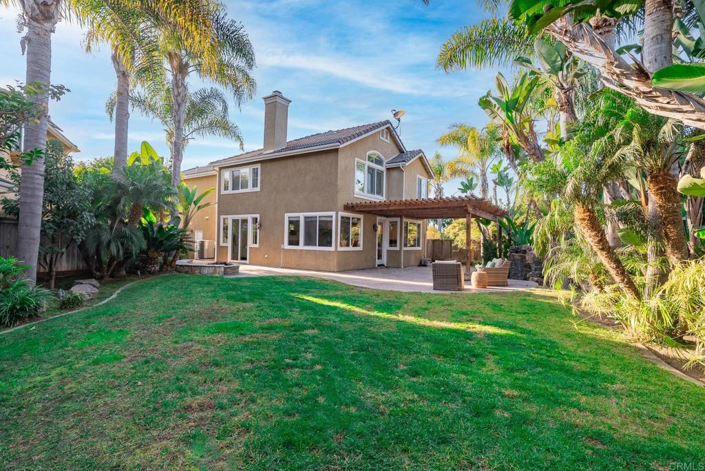 5406 Foxtail Loop Carlsbad, CA 92010 - Photo 42 of 50 a view of a house with a yard porch and sitting area