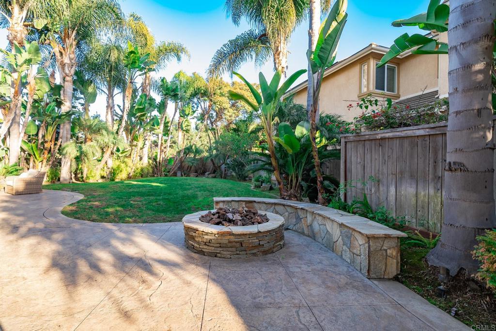 5406 Foxtail Loop Carlsbad, CA 92010 - Photo 44 of 50 a view of a backyard with plants and tree