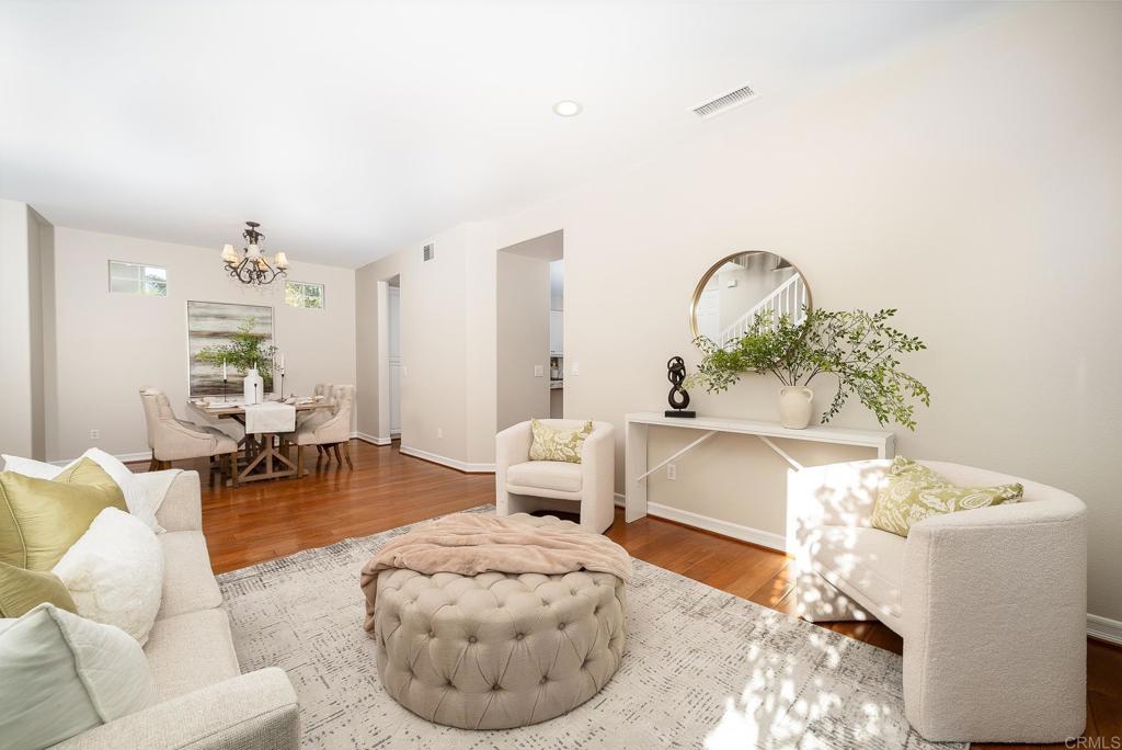 5406 Foxtail Loop Carlsbad, CA 92010 - Photo 9 of 50 a living room with furniture and a potted plant