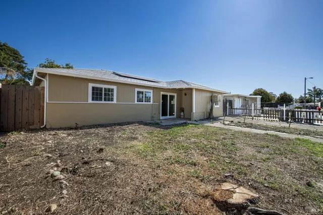 a house view with a backyard space