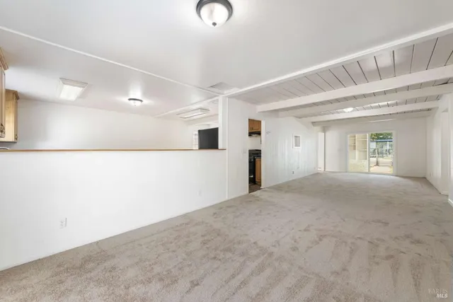 an empty room with a windows