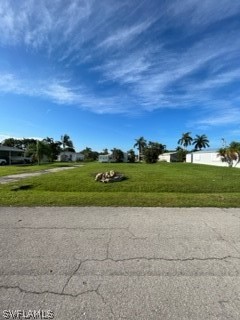 7727 Carpenter Road Bokeelia, FL 33922 - Photo 1 of 4 a view of a golf course with a yard