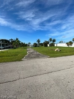 7727 Carpenter Road Bokeelia, FL 33922 - Photo 2 of 4 a view of a road with an ocean