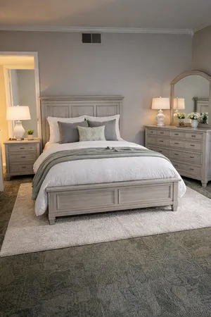 a spacious bedroom with a bed and lamp