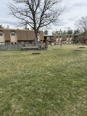 a view of a yard with table and chairs