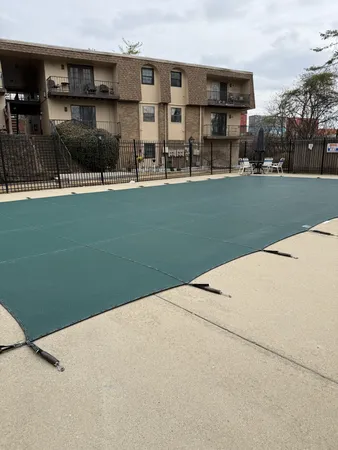 a backyard of a house with barbeque oven
