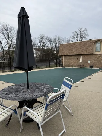 a backyard of a house with barbeque oven