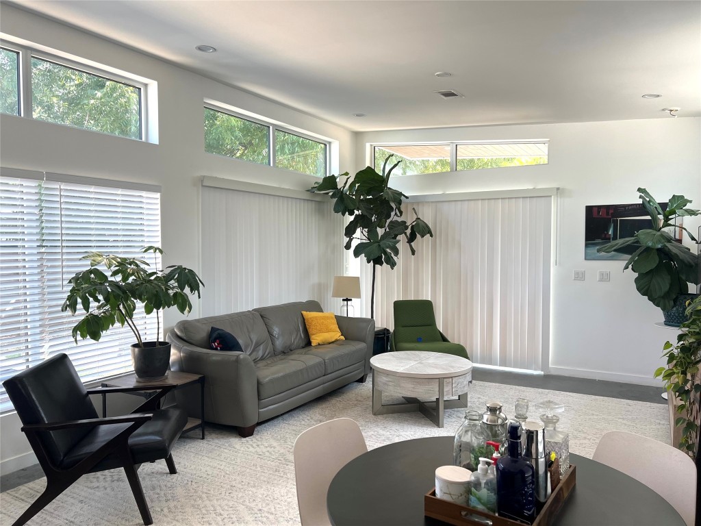 1159 Perry Road, Unit A Austin, TX 78721 - Photo 16 of 23 Living area with baseboards and carpet