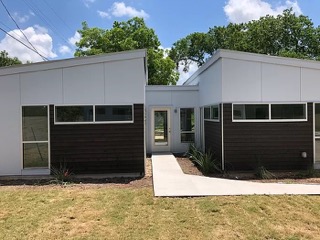 1159 Perry Road, Unit A Austin, TX 78721 - Photo 22 of 23 Rear view of house with a lawn