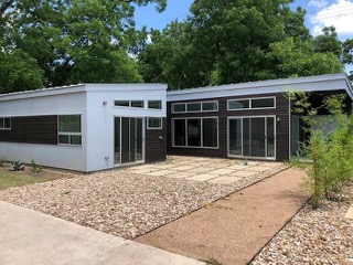 1159 Perry Road, Unit A Austin, TX 78721 - Photo 23 of 23 Rear view of house with stucco siding
