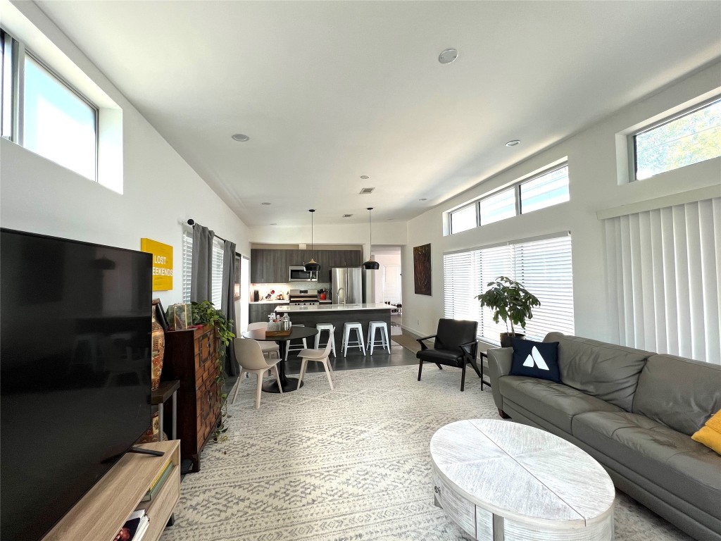 1159 Perry Road, Unit A Austin, TX 78721 - Photo 7 of 23 Living room with healthy amount of natural light