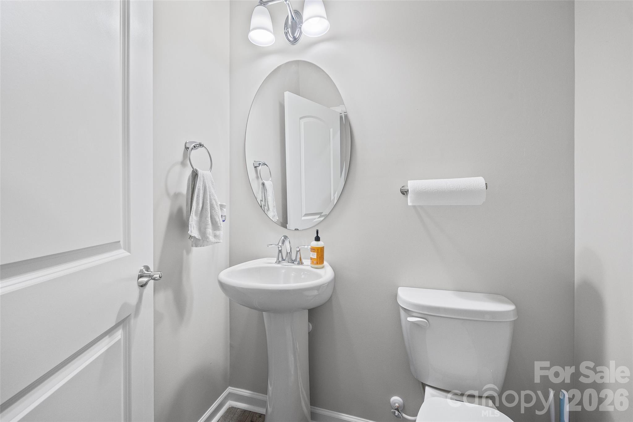 12000 Sam Snead Court Lancaster, SC 29720 - Photo 14 of 36 a bathroom with a sink mirror vanity and toilet