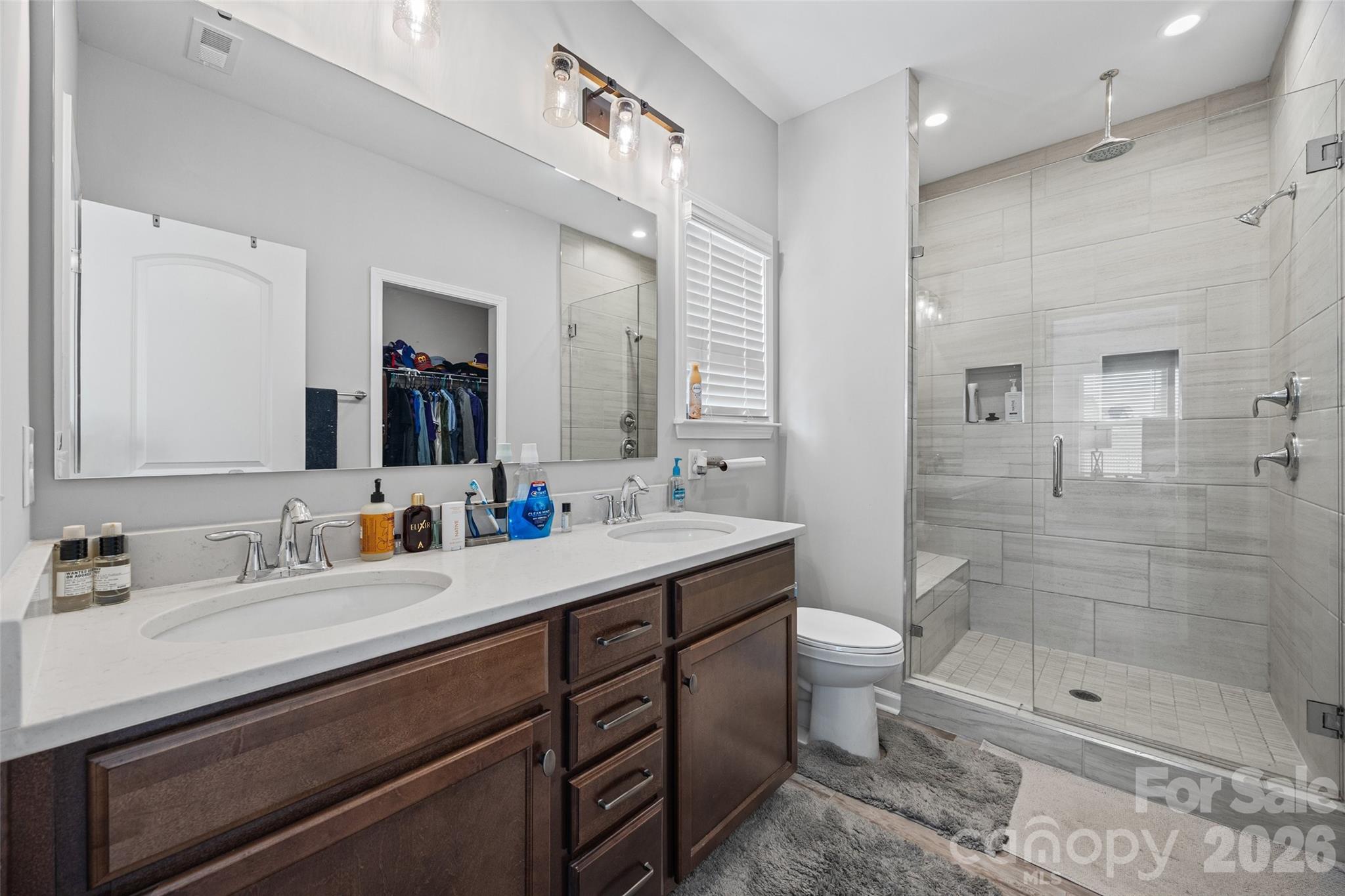 12000 Sam Snead Court Lancaster, SC 29720 - Photo 17 of 36 a bathroom with a sink a toilet and shower
