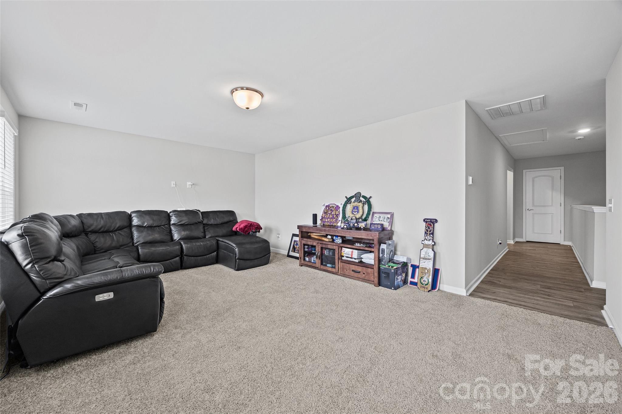12000 Sam Snead Court Lancaster, SC 29720 - Photo 19 of 36 a living room with furniture and a gym machine