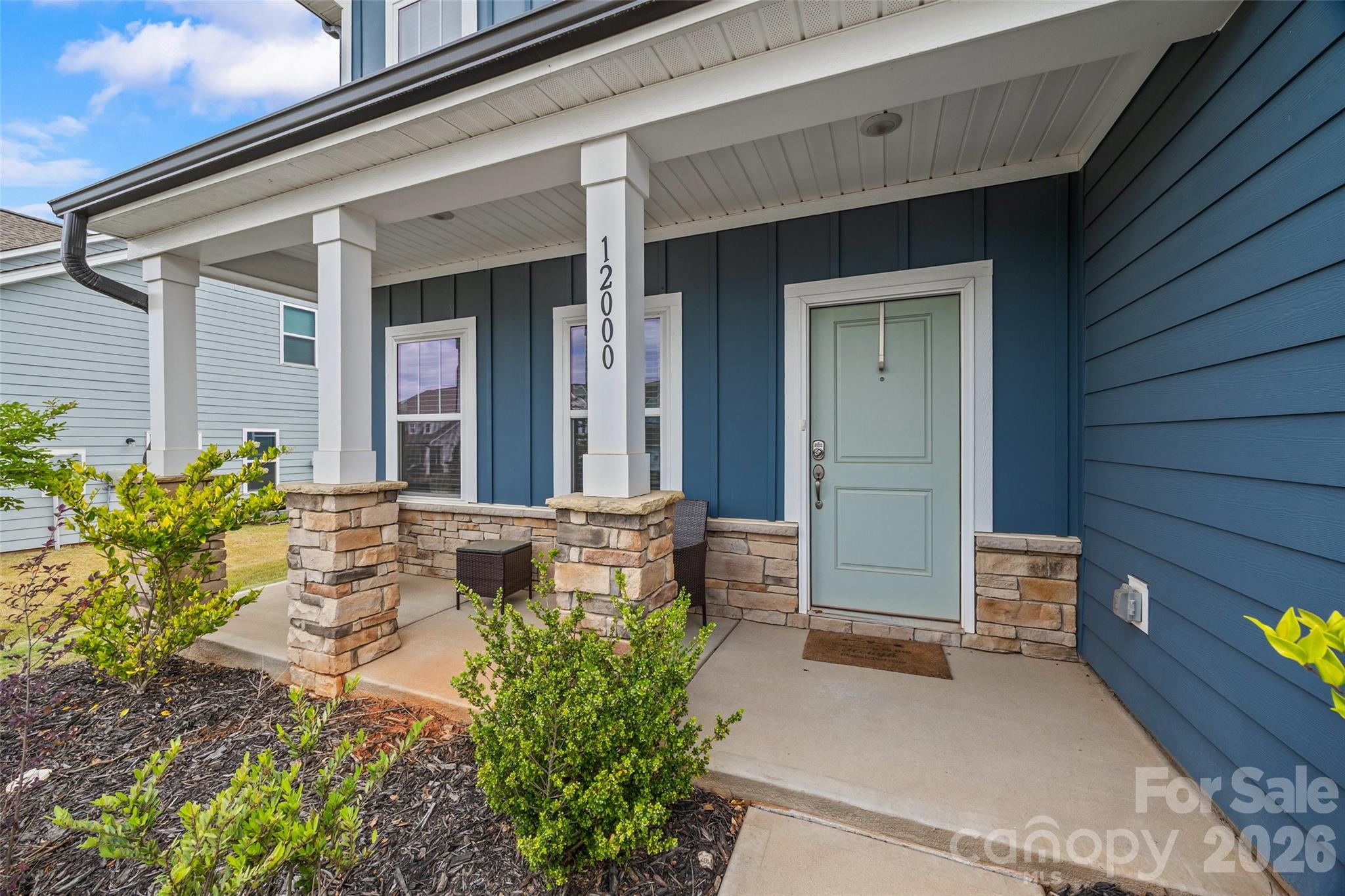 12000 Sam Snead Court Lancaster, SC 29720 - Photo 2 of 36 a front view of a house with outdoor seating
