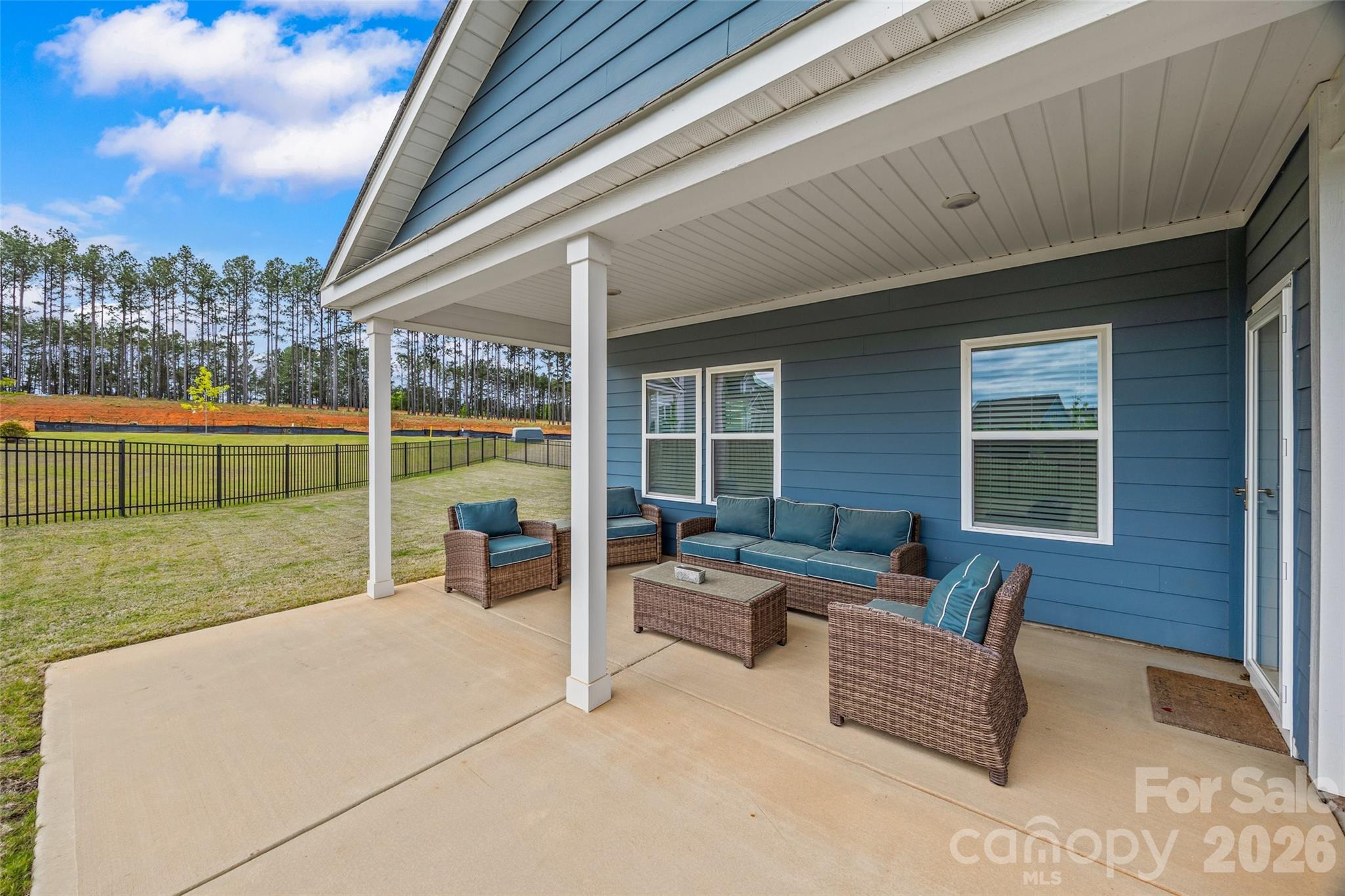 12000 Sam Snead Court Lancaster, SC 29720 - Photo 26 of 36 a view of a patio with couches chairs and city view
