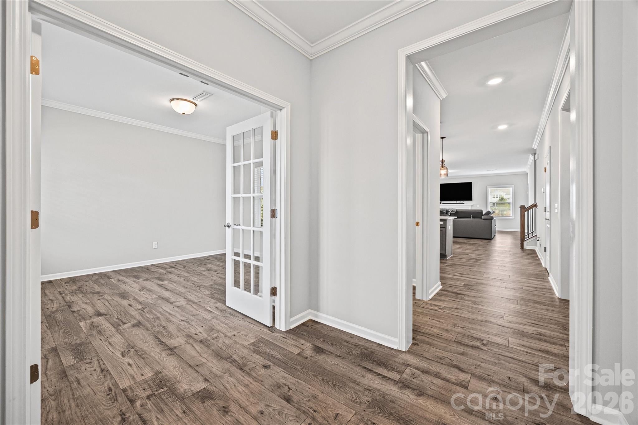 12000 Sam Snead Court Lancaster, SC 29720 - Photo 3 of 36 a view of a hallway with wooden floor and staircase