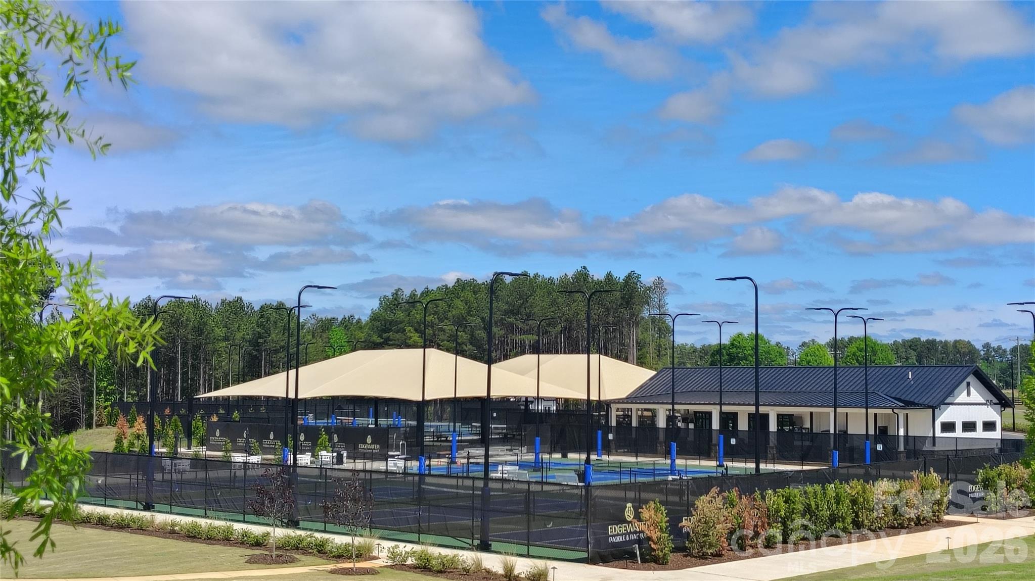12000 Sam Snead Court Lancaster, SC 29720 - Photo 34 of 36 a view of swimming pool with outdoor seating and yard in back